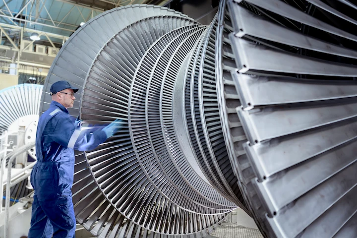 Engineer inspecting a low pressure steam turbine