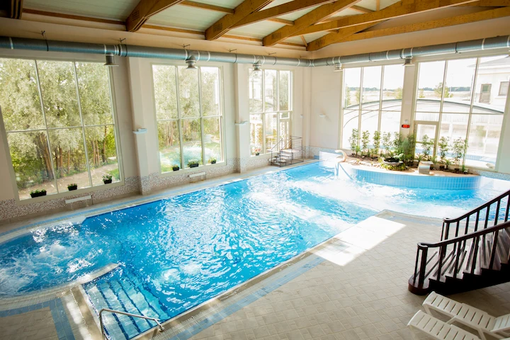 Indoor swimming pool with large windows